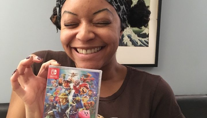 Me, a fan of Smash Bros., holding up a copy of the game that I bought on opening day.