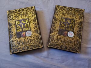 black sci fi short stories anthology by flame tree press