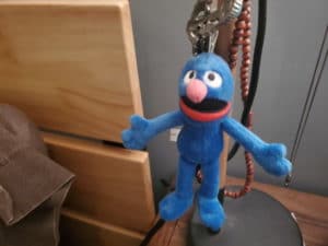 toy grover on bedside table