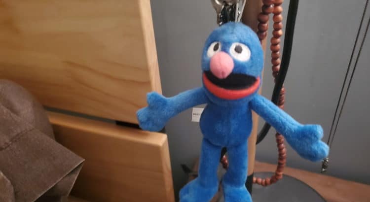 toy grover on bedside table